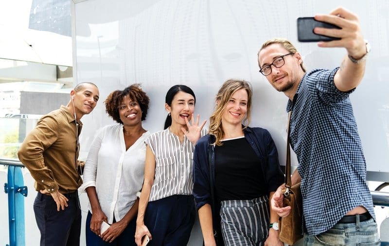 group of colleagues taking a selfie