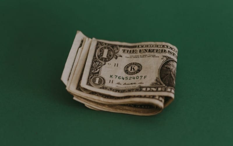 Dollars on a green background getting paid for music