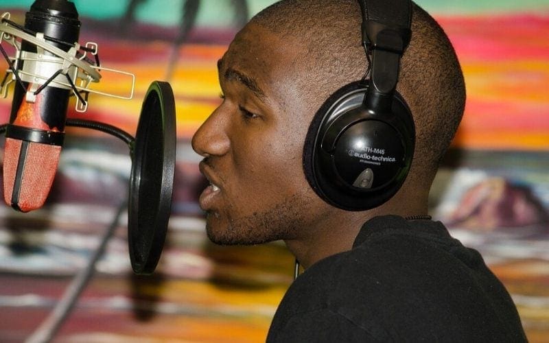 Man recording vocals for free sample packs