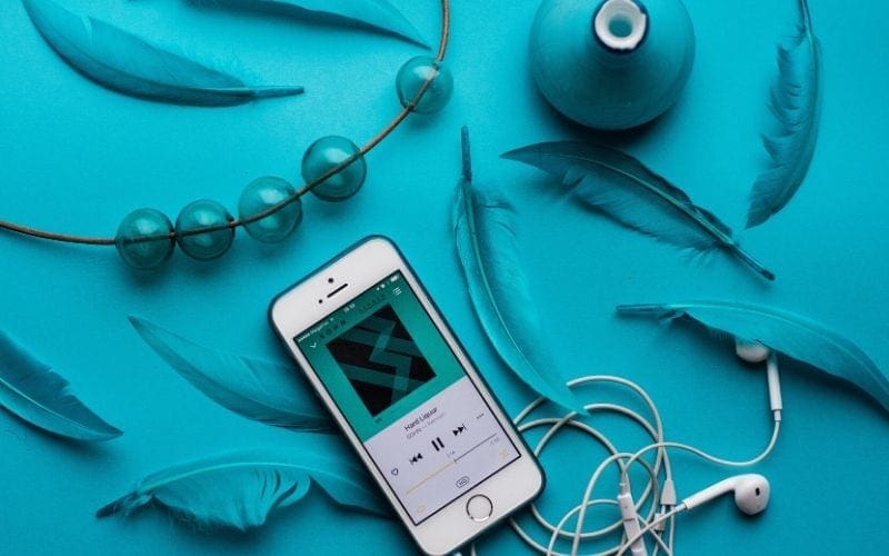 Phone playing music on a blue background