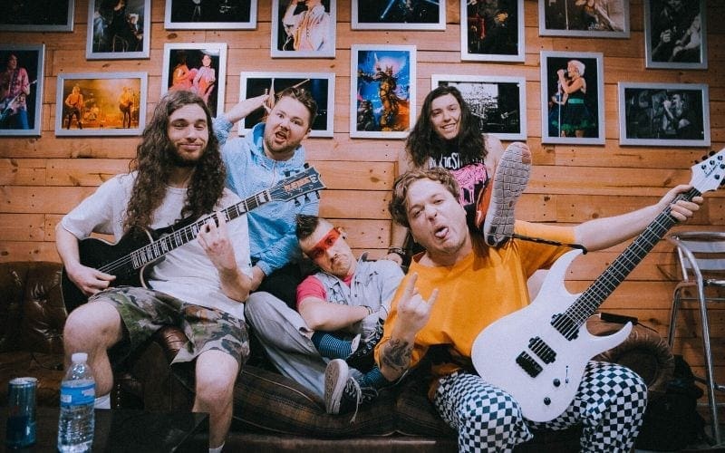 Band on sofa with instruments music branding