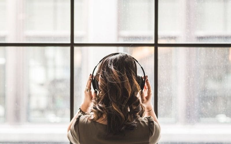 woman with headphones music supervisor