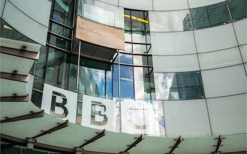 low angle view of the facade to the new entrance of the BBC Headquarters, Broadcasting House, in Portland Place and Langham Place, London.