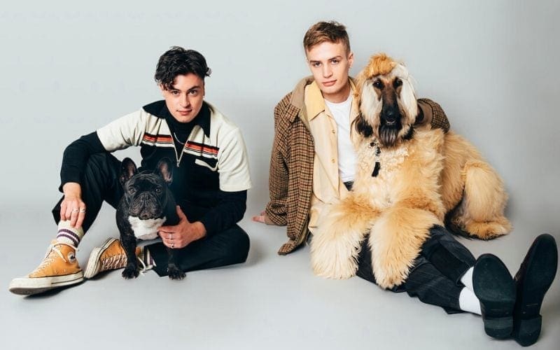 Mahogany recordings artist KAWALA on the floor with dogs