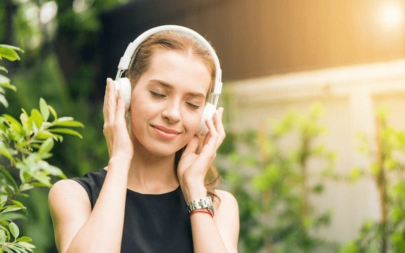 woman with headphones listening to music