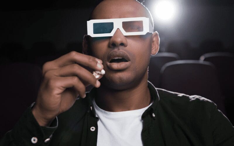 man eating popcorn