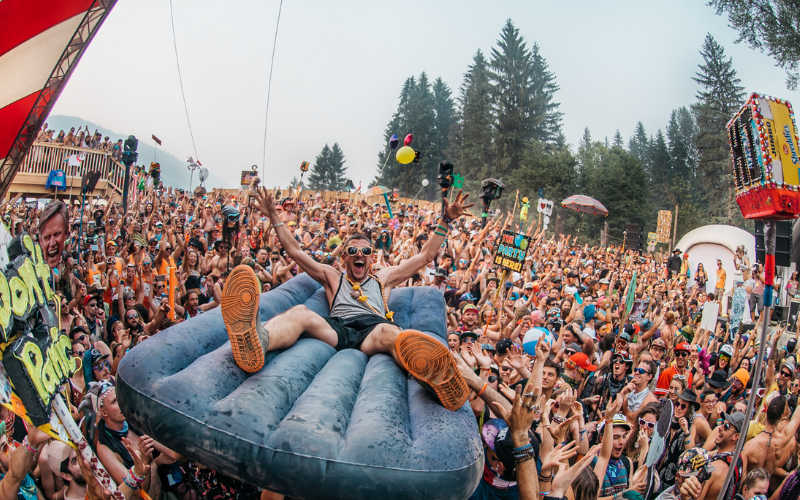 man crowd surfing at a concert