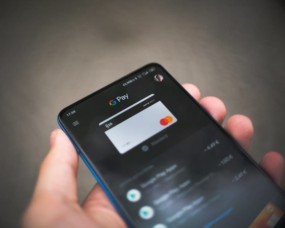 A man using google pay on his phone.