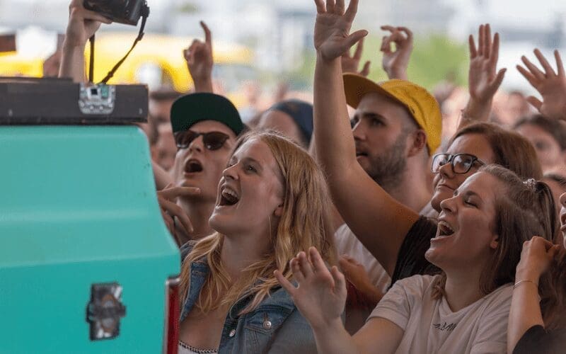 crowd singing at a concert