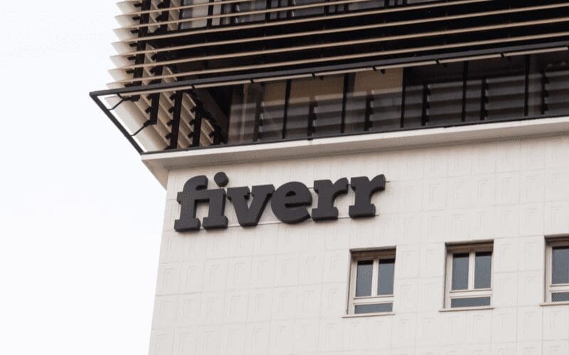 A building with the fiverr logo in the corner. Fiverr