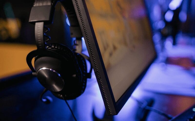 headphones on a stand with a computer
