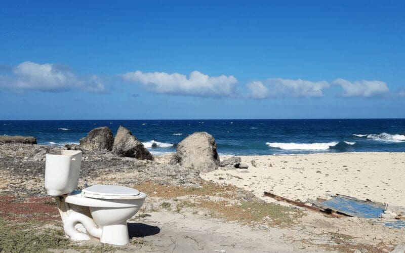 Random toilet on a beach.