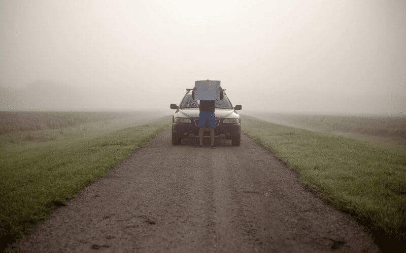 A man lost on a long road.