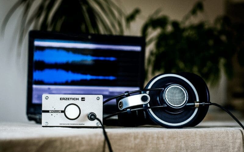 headphones with laptop recording a composition