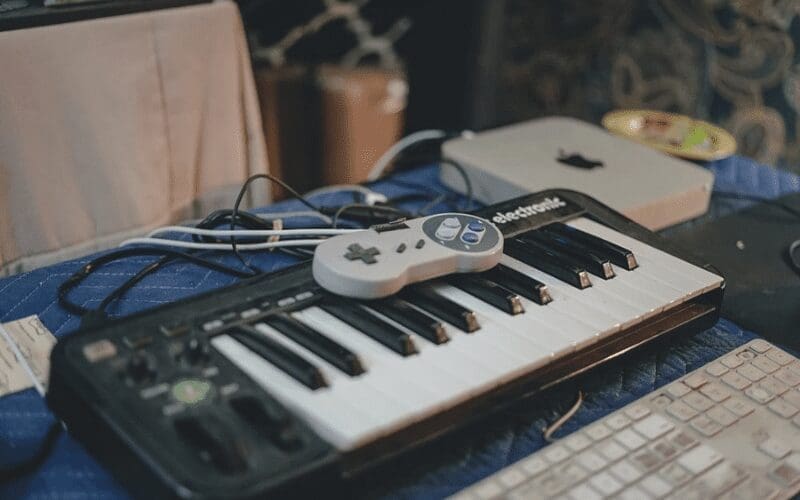 game controller on piano video game music composer