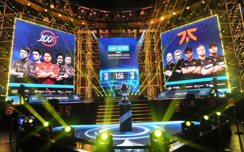 esports event with two teams and a trophy championship