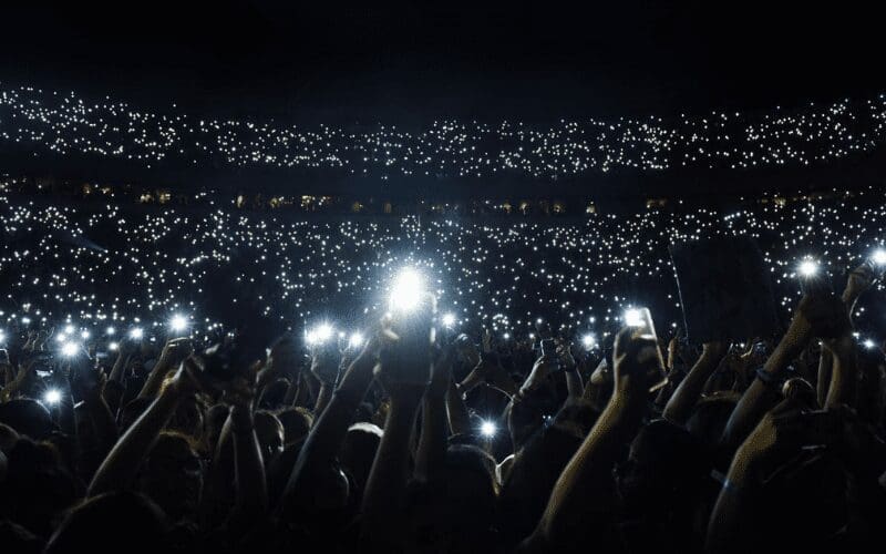 phones at a concert flash
