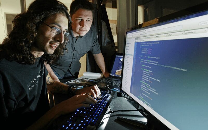 Two game developers discuss their programming