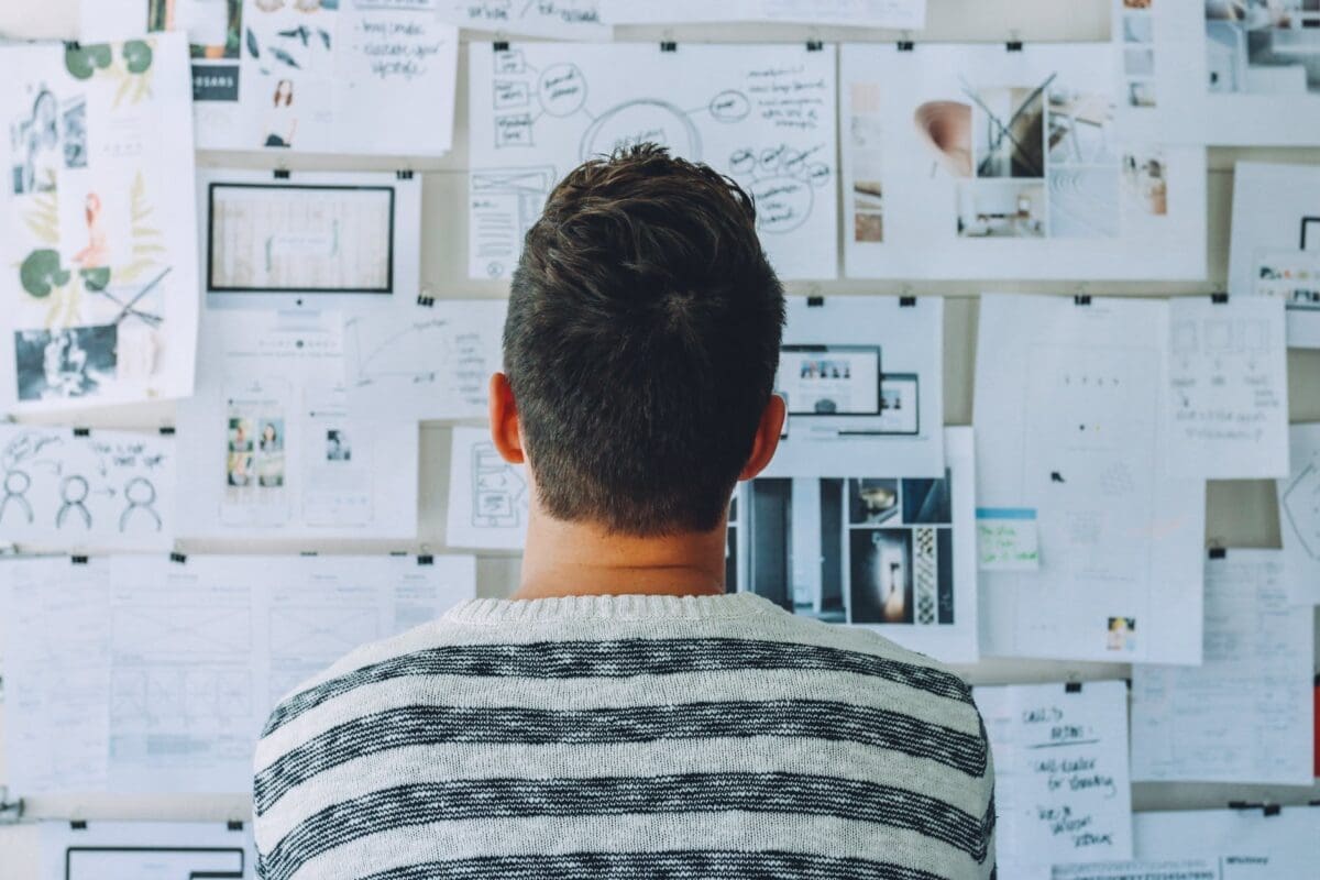 man looking at notes