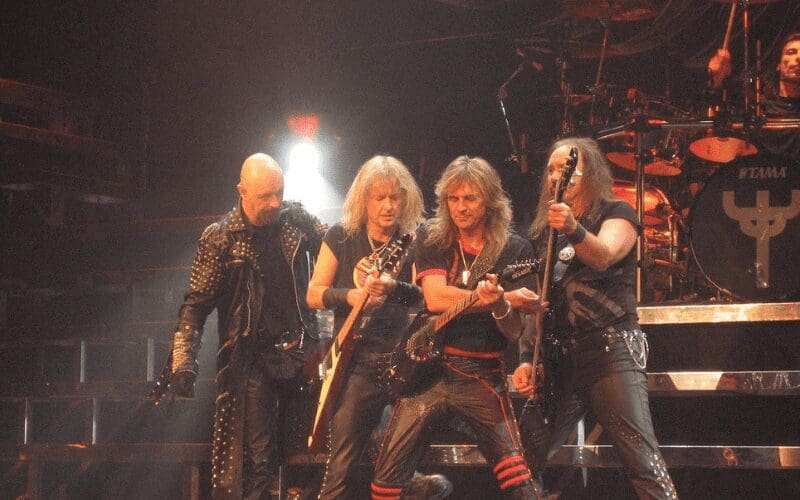 judas priest on stage performing