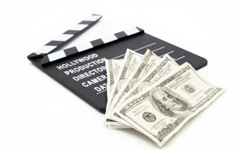 movie clapboard with money