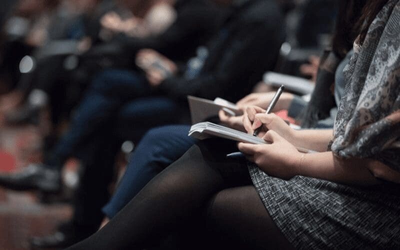 taking notes at networking event