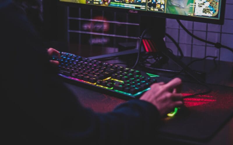 pc gaming vs console person using gaming keyboard 