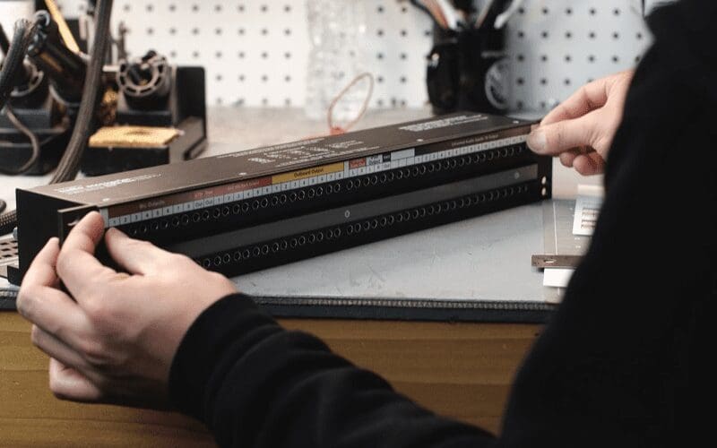man working on patchbay 