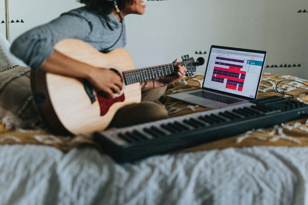 Guitarist practising in a bedroom