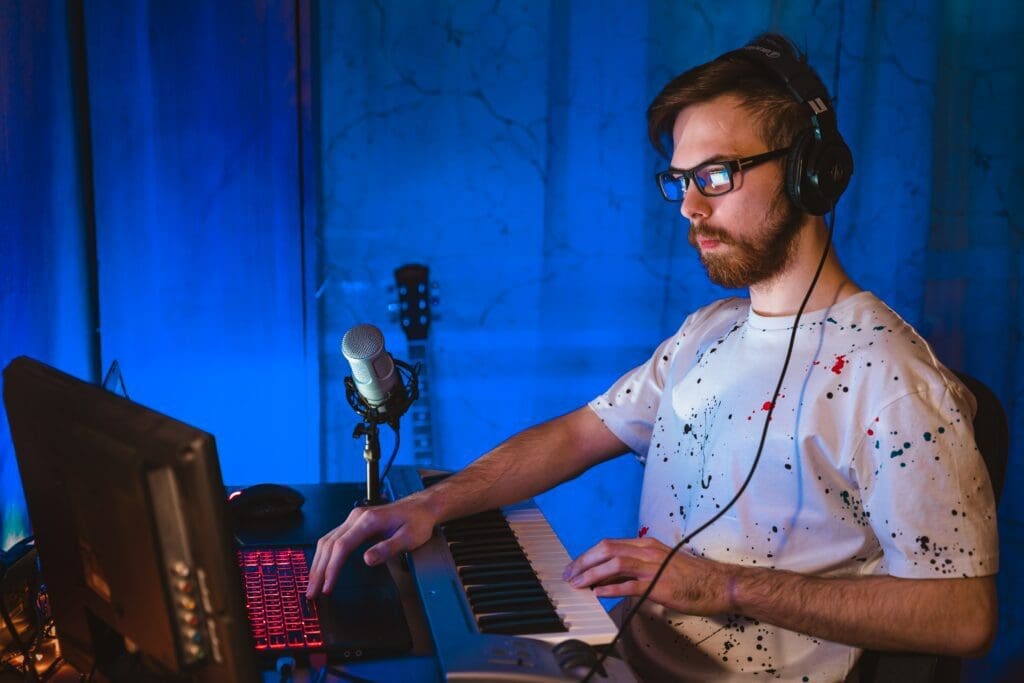 Man sits at his DAW creating music